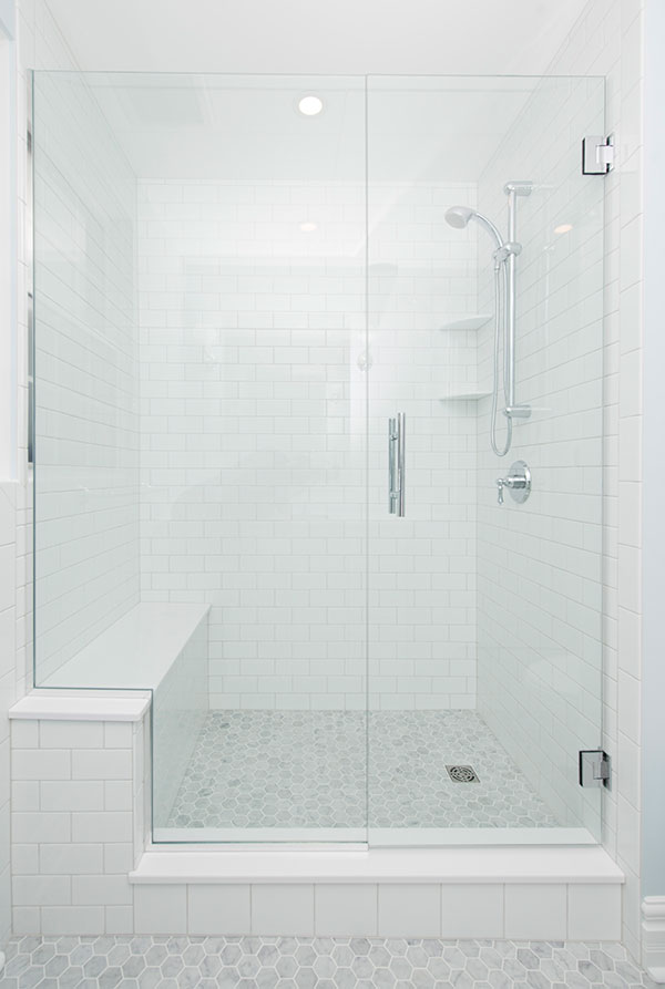 A shower with a bench for better accessibility.