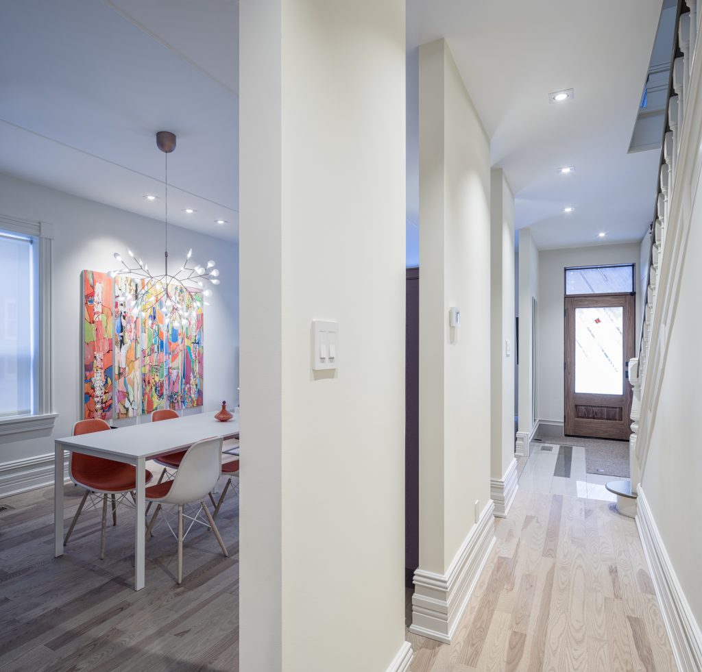 This hallway features stunning baseboards and hardwood floors.